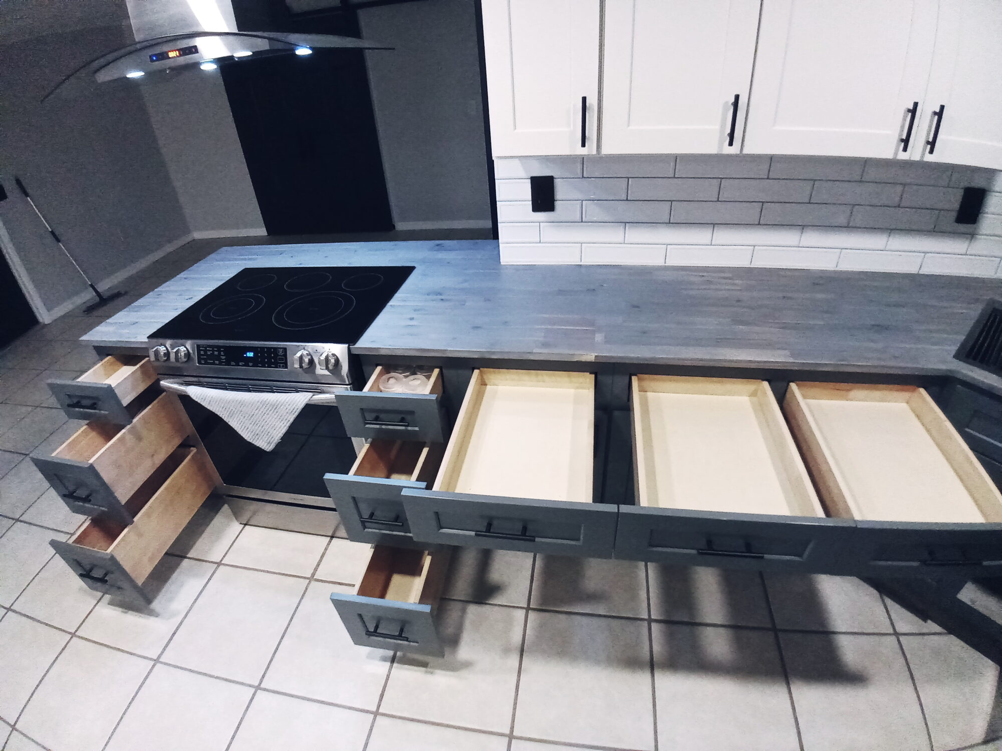 Custom built kitchen island with many drawers