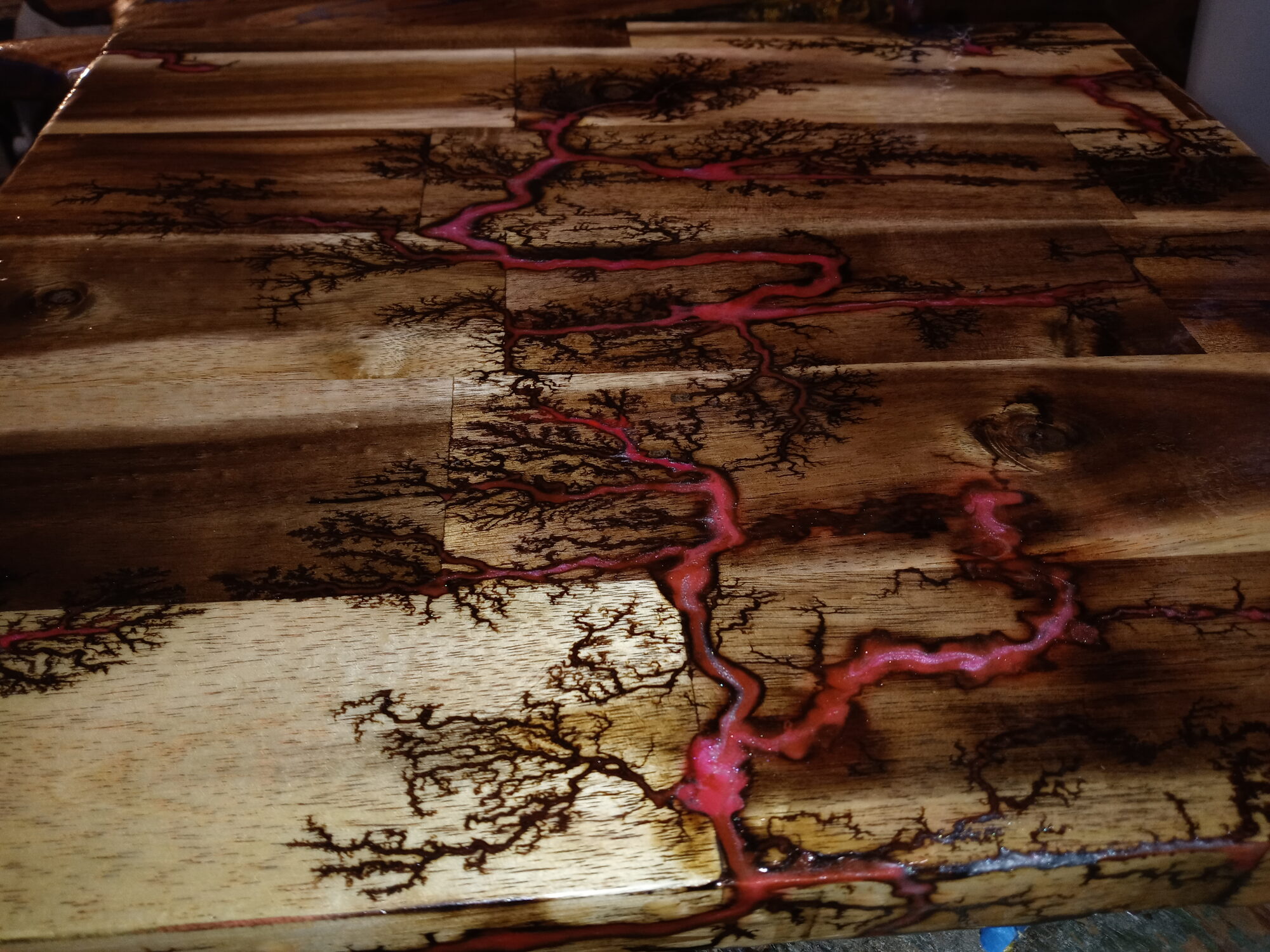 Large acacia table with red resin fractal veins