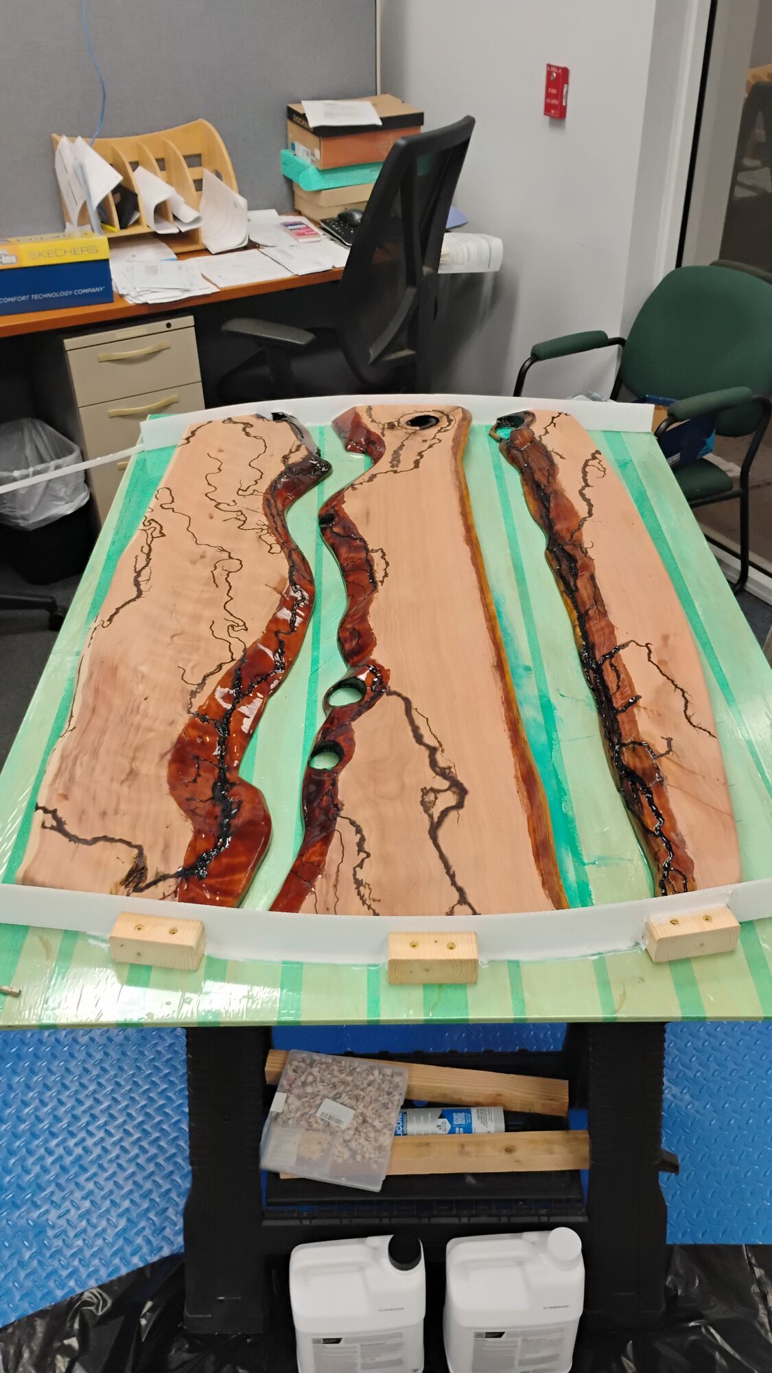 Amber red and teal resin poured