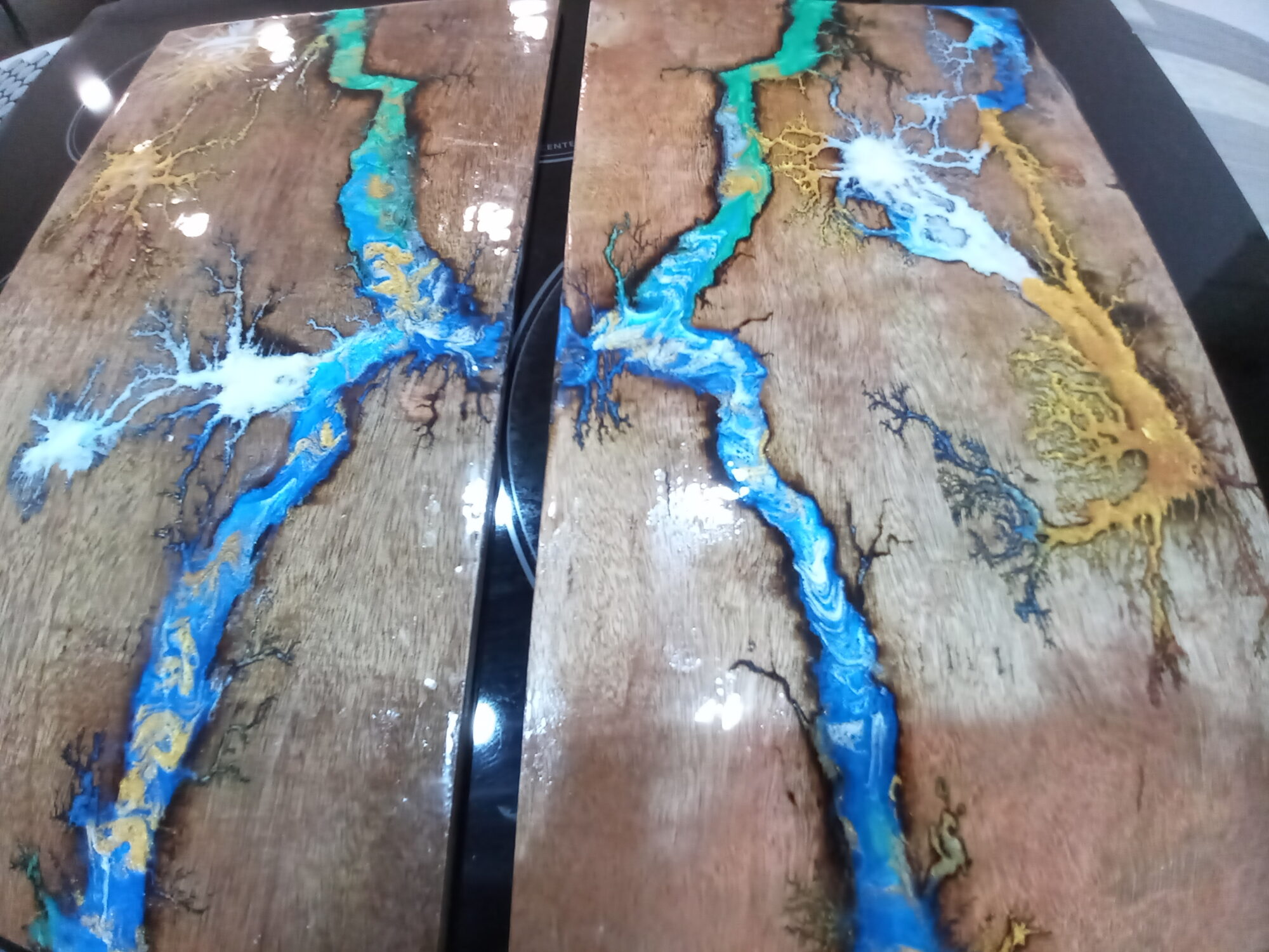 Walnut panels with blue gold and white resin rivers