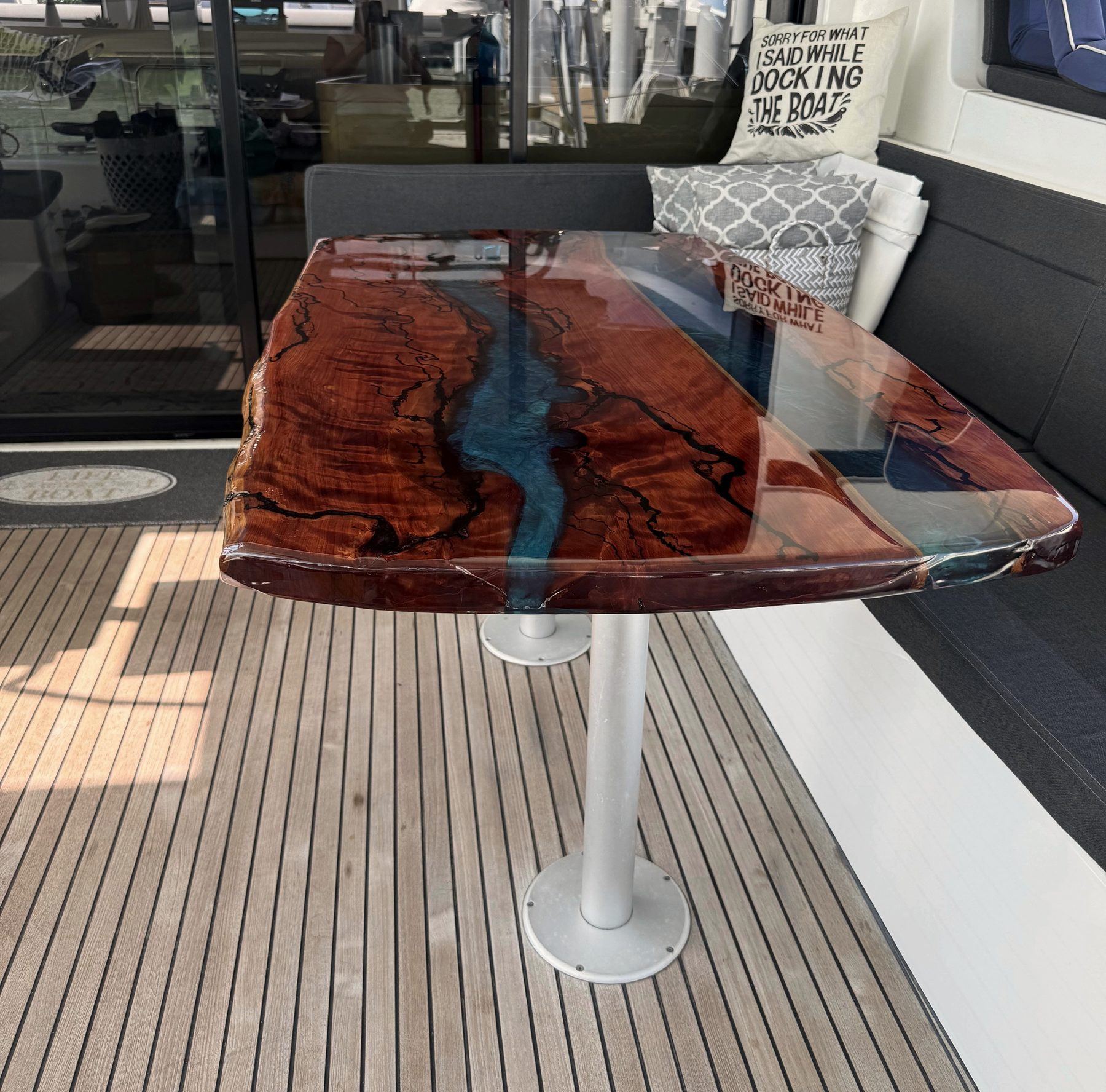 The finished table installed on a yacht's aft deck