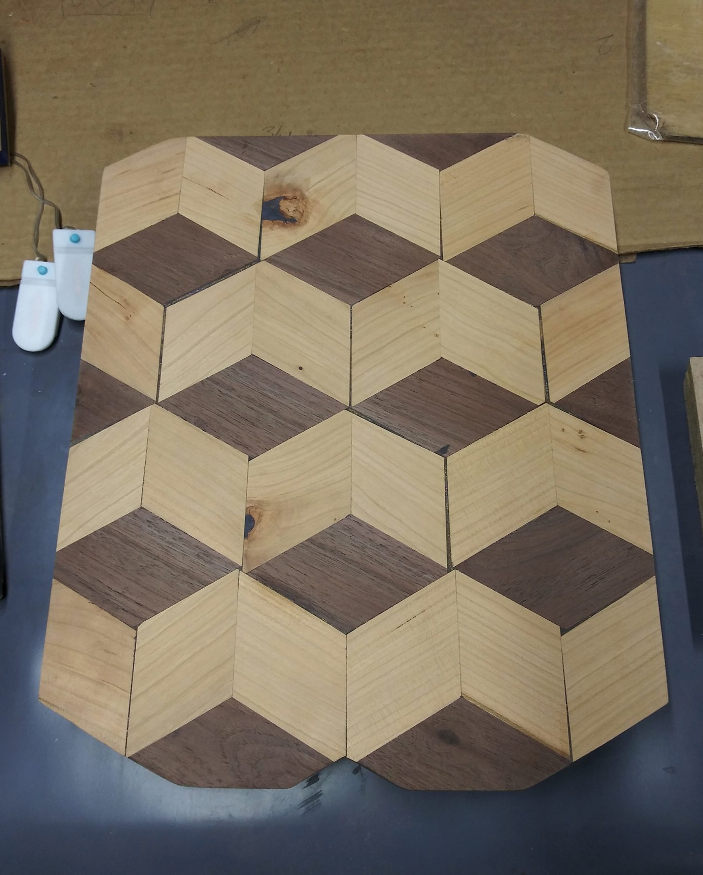 Walnut and ash glued up in the tumbling-block pattern, before the burn